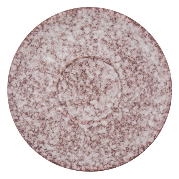 A close-up of a Biseki Himalayan salt stoneware saucer with a marbled surface.
