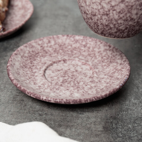 A Biseki Himalayan salt saucer with a cup on a table.