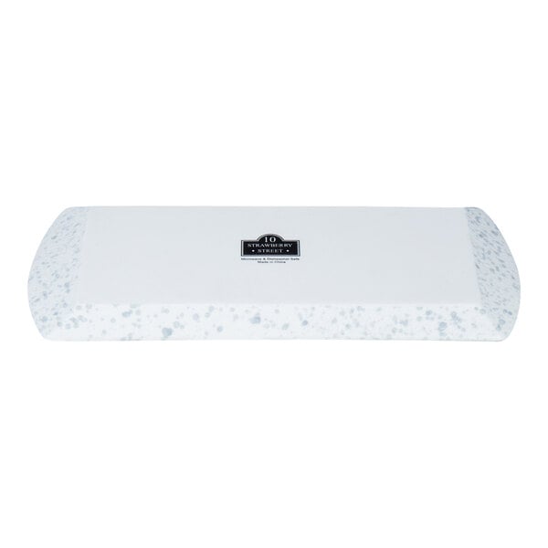 A rectangular porcelain platter with blue speckles and slightly curved edges.