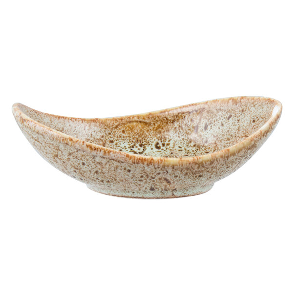 A close-up of a white bowl with a brown speckled design.