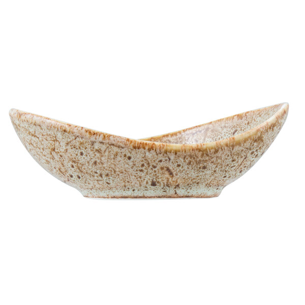 A close-up of a 10 Strawberry Street Tiger Eye porcelain bowl with a brown and white speckled surface.