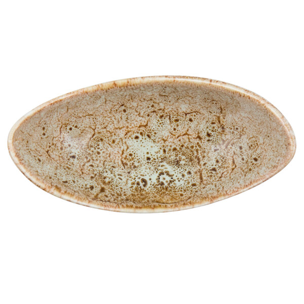 A white porcelain canoe-shaped bowl with brown speckles.