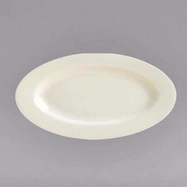 A white oval china platter with a narrow rim.