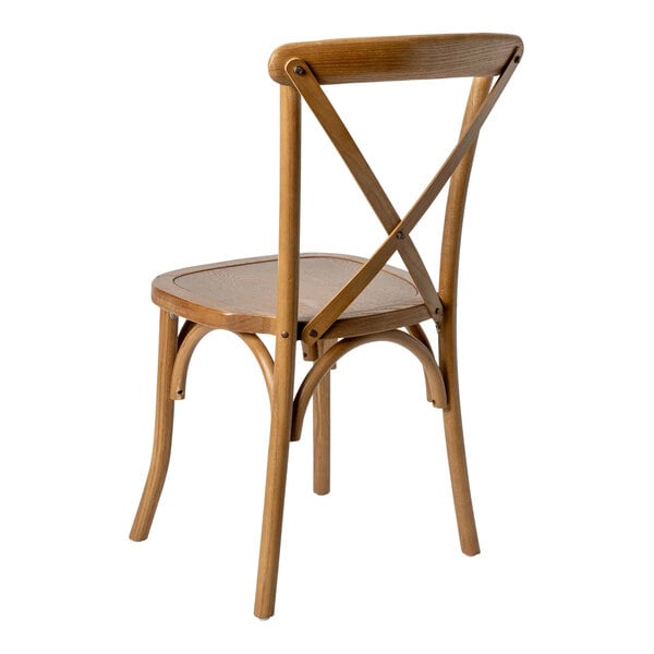 A wooden chair with a curved backrest and an X-shaped cross back design, shown from a rear angle.