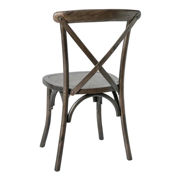 A wooden chair with a curved backrest and an X-shaped cross back design, shown from the rear.