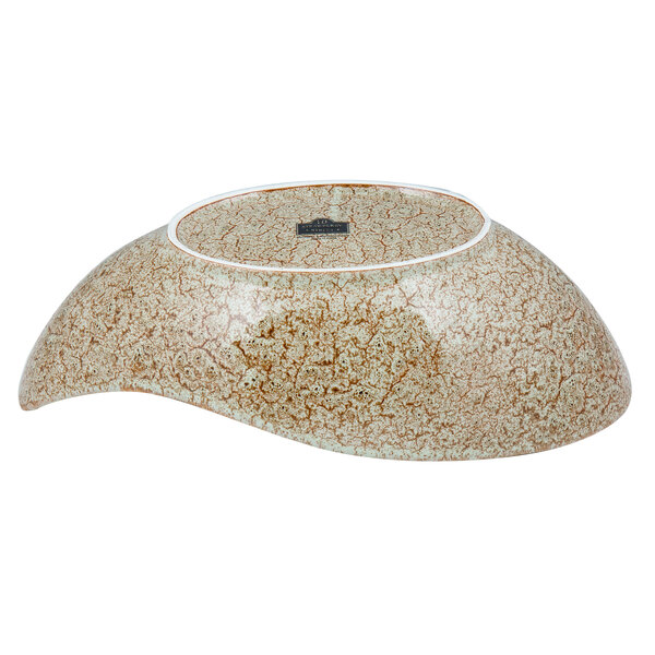 A brown porcelain canoe bowl with a white rim.