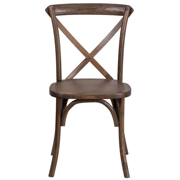 A Flash Furniture Hercules Early American wooden chair with a cross back.