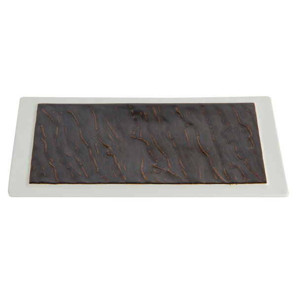 A Tuxton TuxTrendz rectangular plate with brown and white stripes.