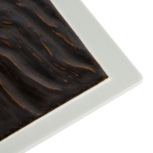 A Tuxton TuxTrendz rectangular china plate with a black and white pattern.