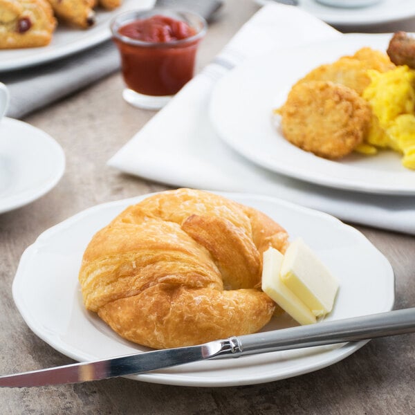 A Tuxton TuxTrendz Charleston white china plate with a pastry on it.