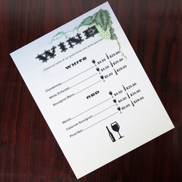 Menu paper with a grapevine design and a wine glass on it.