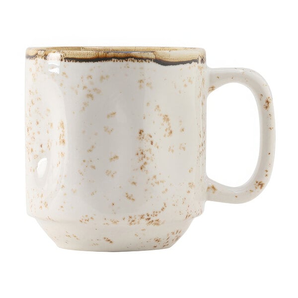 A white coffee mug with brown speckles.