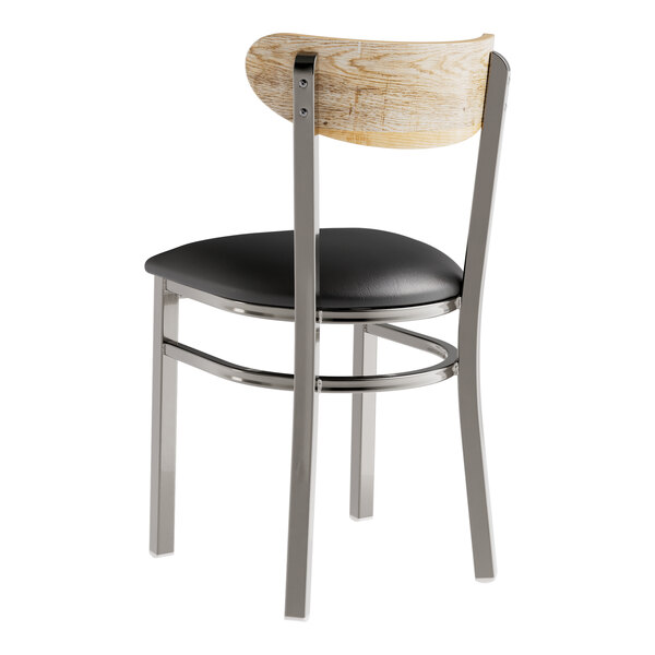 A Lancaster Table & Seating chair with a black vinyl seat and driftwood back.