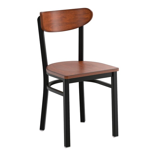 A black metal chair with an antique walnut wood seat and backrest.