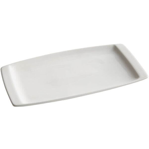 A white rectangular Tuxton China plate with a handle.