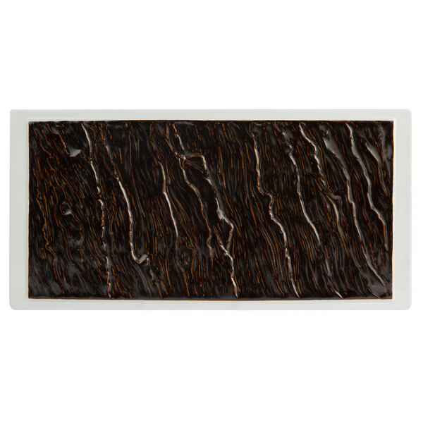 A rectangular black and white Tuxton china platter.