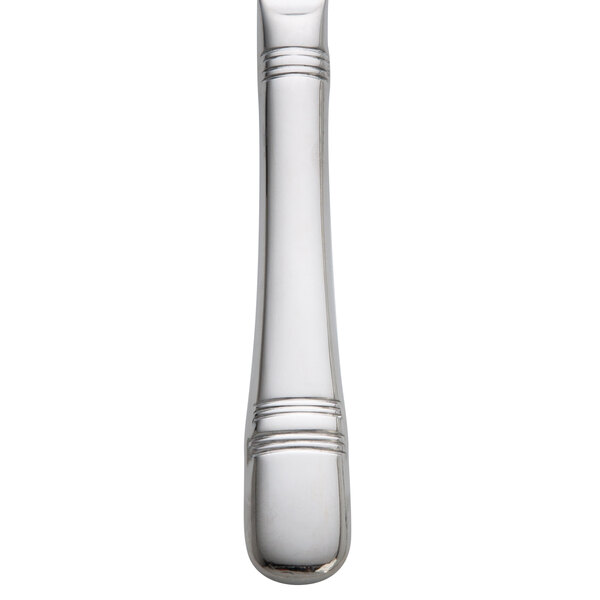 A Oneida Astragal stainless steel butter spreader with a white background.
