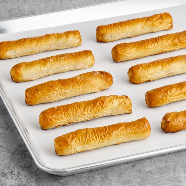 A white tray of Dutch Country Foods Pennsylvania Dutch Soft Pretzel Sticks.