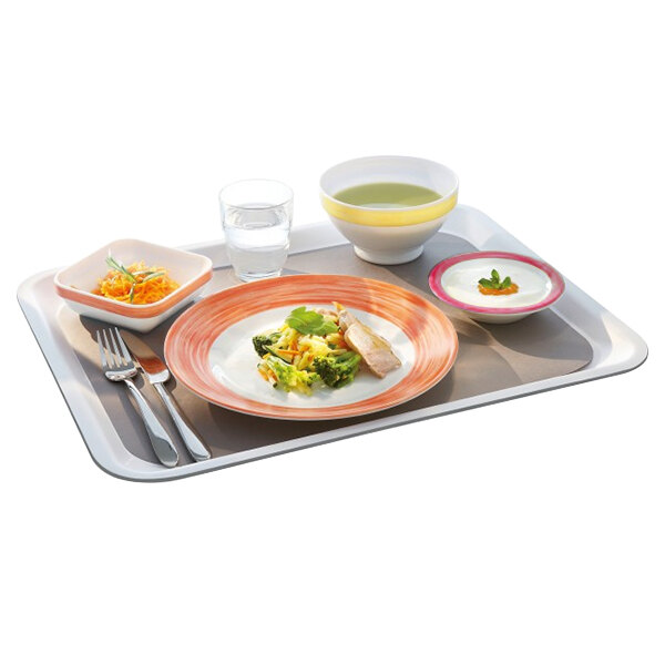 An Arcoroc cherry fruit bowl filled with food on a tray.