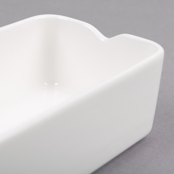 A close-up of a white rectangular Arcoroc Mekkano bowl.