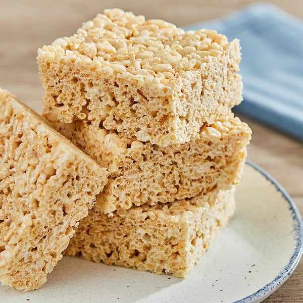 A stack of rice crispy treats on a plate.