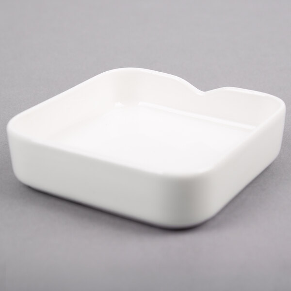 A white square Arcoroc Mekkano bowl.