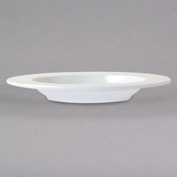 An Arcoroc white porcelain soup bowl on a white background.