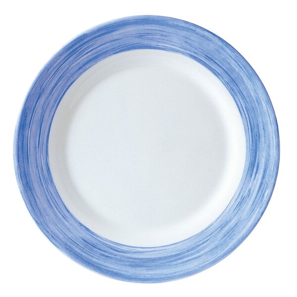 An Arcoroc opal glass side plate with blue and white stripe design.