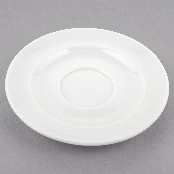 A white Arcoroc porcelain saucer with a circular rim.