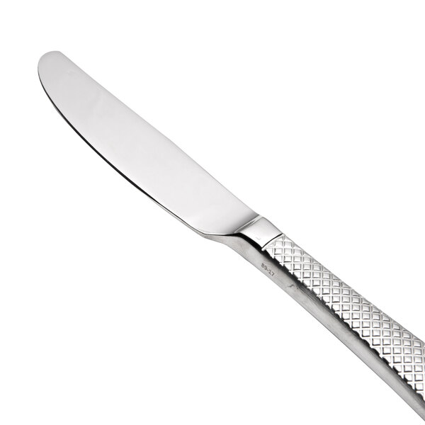 A close-up of a Oneida Jade stainless steel butter knife with a handle.