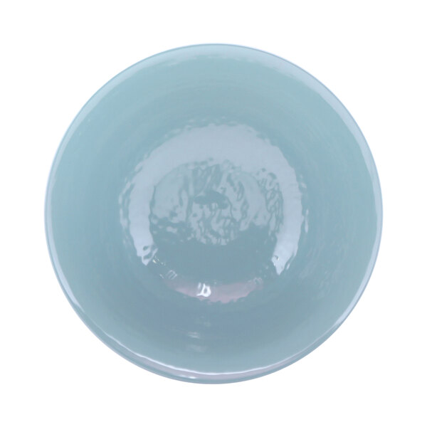 A white melamine bowl with a light blue rim.