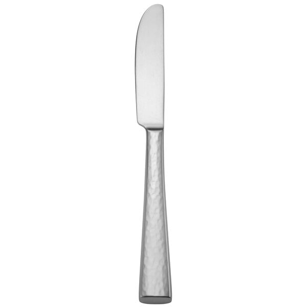 A silver knife with a white handle.