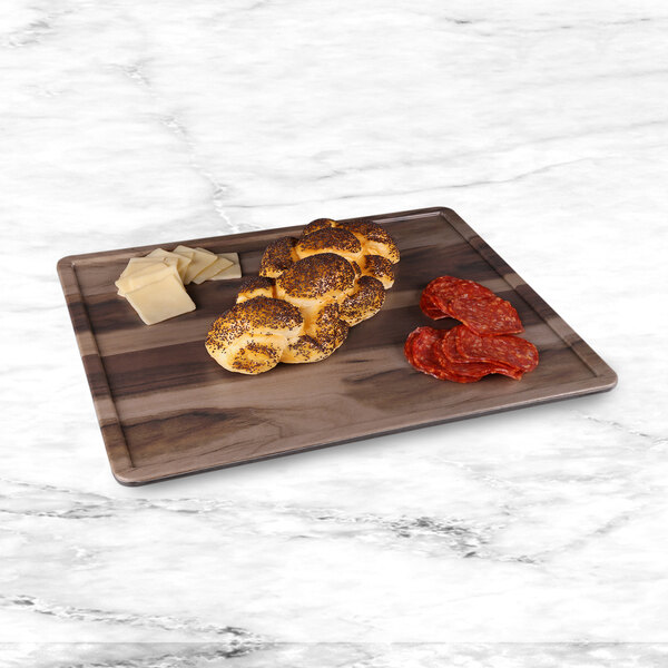 An Elite Global Solutions faux hickory wood melamine serving board with food on it.