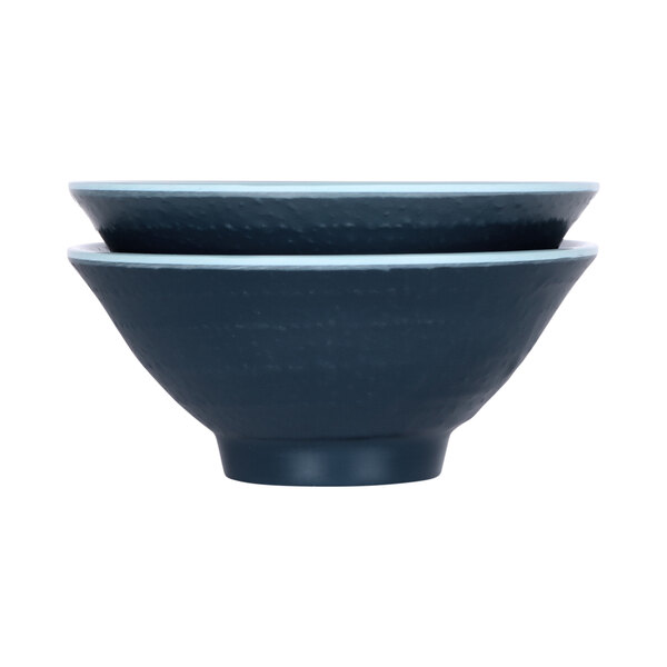 Two Elite Global Solutions round melamine bowls with blue and black designs on them.