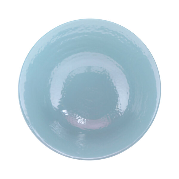 A blue ceramic bowl with a shiny surface.