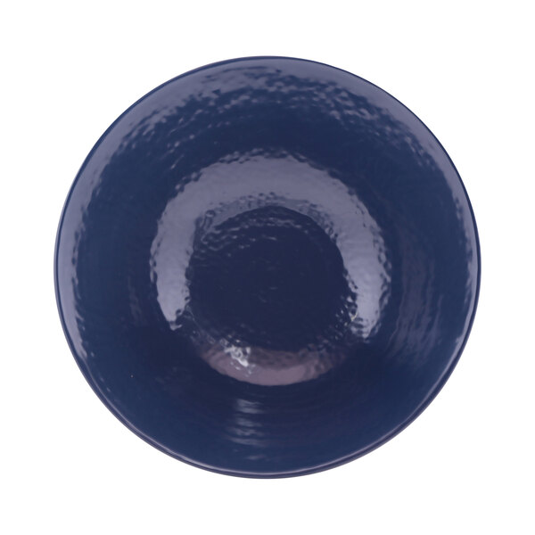 A white melamine bowl with a dark blue rim.