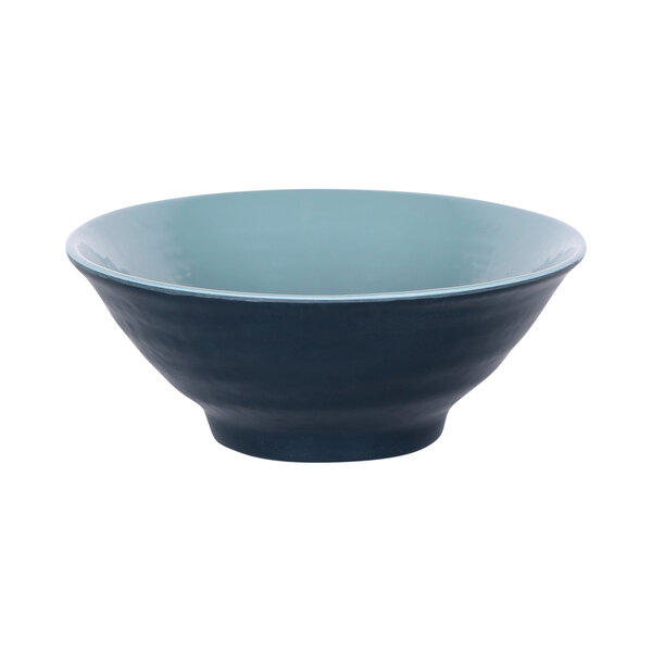 A blue bowl with a white rim.