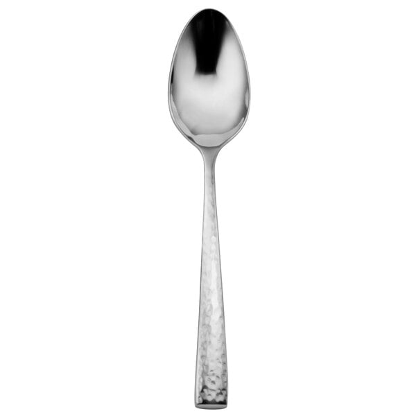 A Oneida Cabria stainless steel teaspoon with a textured handle.