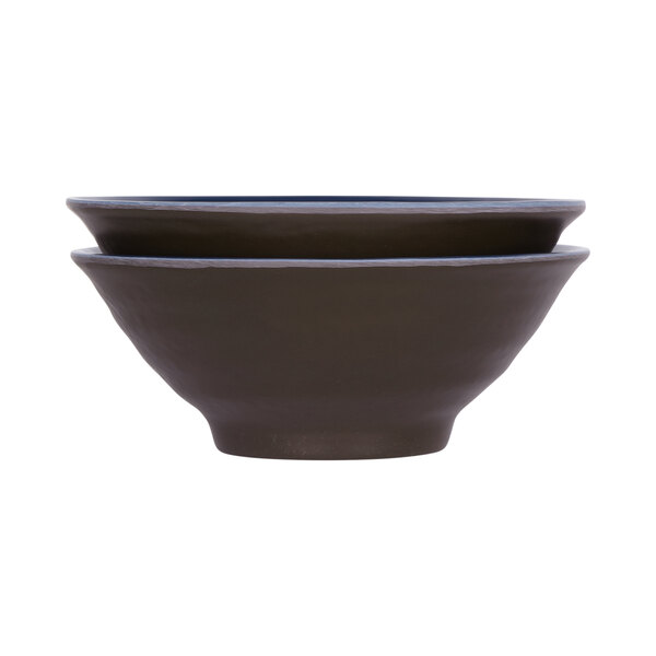 A close up of a black and lapis Elite Global Solutions melamine bowl with a chocolate interior.