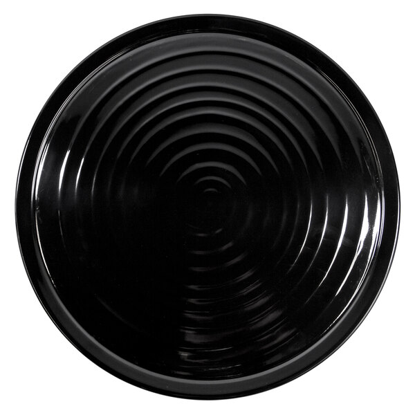 A black Elite Global Solutions melamine plate with a spiral pattern.