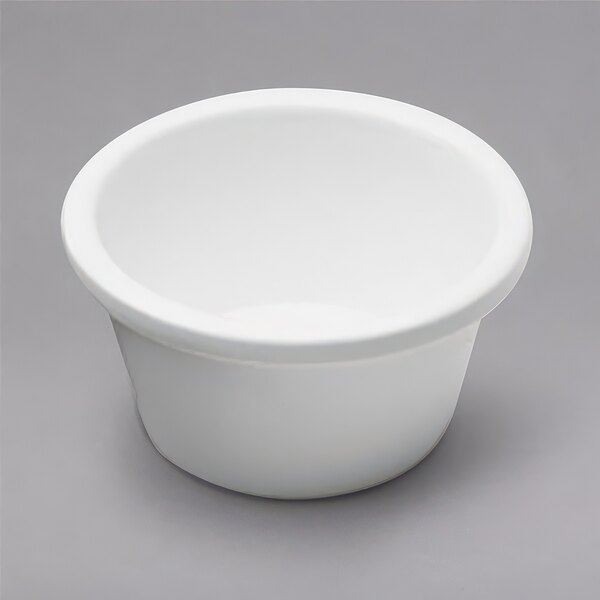 A white Elite Global Solutions melamine ramekin with a white rim.