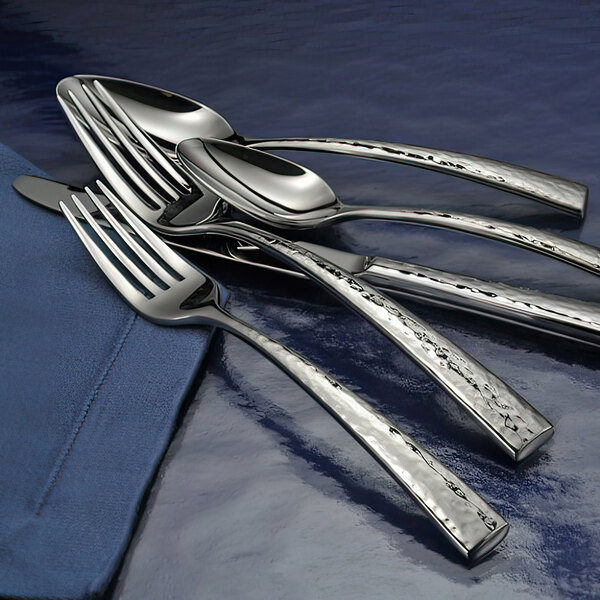 A close-up of a Oneida Cabria stainless steel dinner knife.