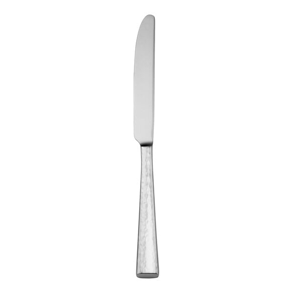 A Oneida Cabria stainless steel dinner knife with a long handle.