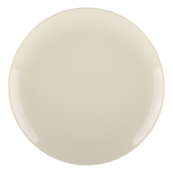 A white plate with a round rim in ebony and sand colors.