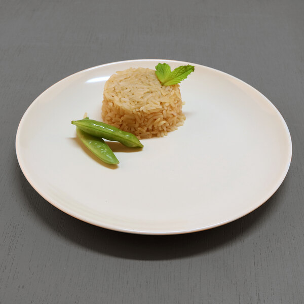 An Elite Global Solutions Karma melamine plate with rice and a green bean on it.
