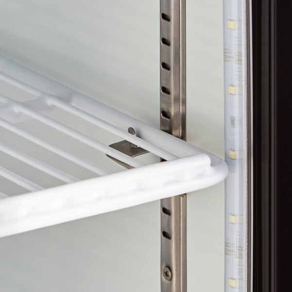 An Avantco countertop display refrigerator shelf with a metal rack and white background.