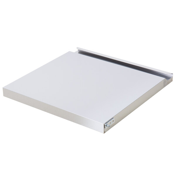 The bottom half of a white metal refrigerator door with a metal frame.