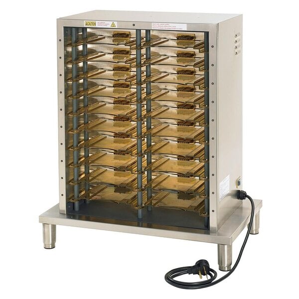 A metal cabinet with a black cord plugged into it and trays inside.