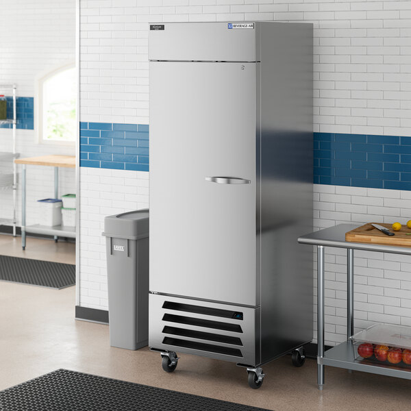 A commercial stainless steel reach-in refrigerator with a solid left-hinged door and bottom-mounted compressor.