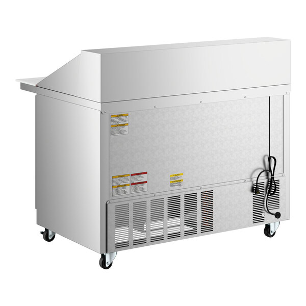 A stainless steel, two-door mega top ADA height refrigerated sandwich prep table on casters.